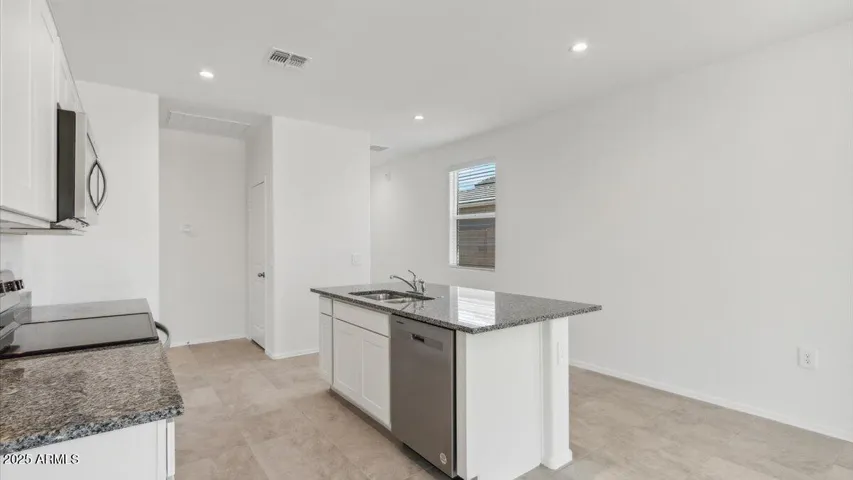 Photos are of a spec and may vary in color, interior selections and design