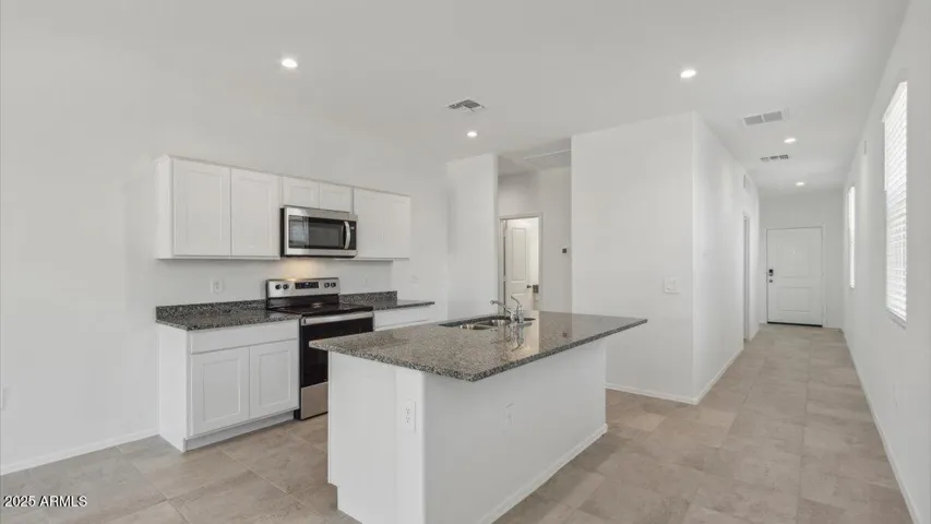 Photos are of a spec and may vary in color, interior selections and design