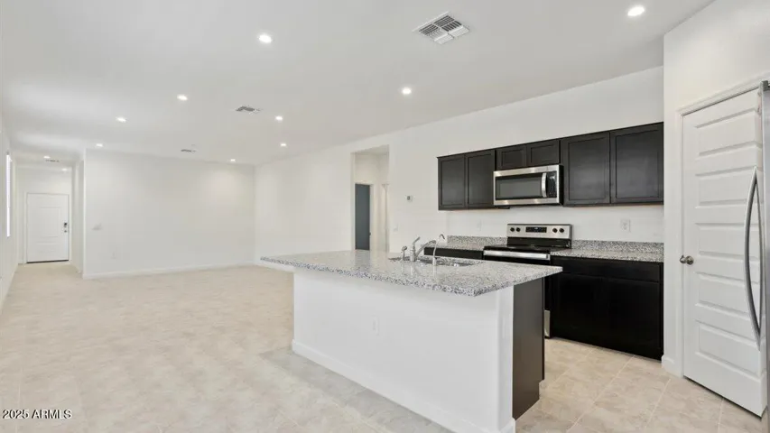 Photos are of a spec and may vary in color, interior selections and design