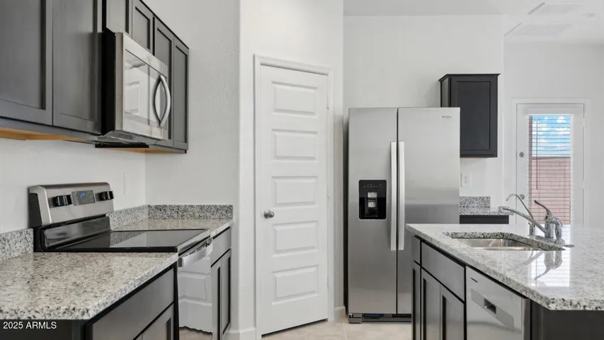 Photos are of a spec and may vary in color, interior selections and design