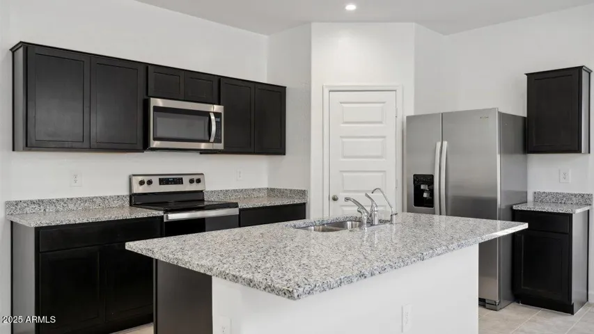 Photos are of a spec and may vary in color, interior selections and design