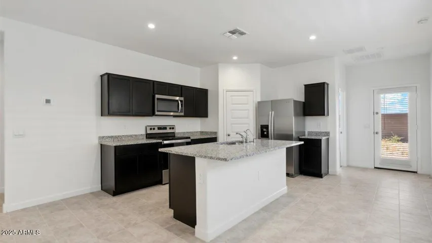 Photos are of a spec and may vary in color, interior selections and design