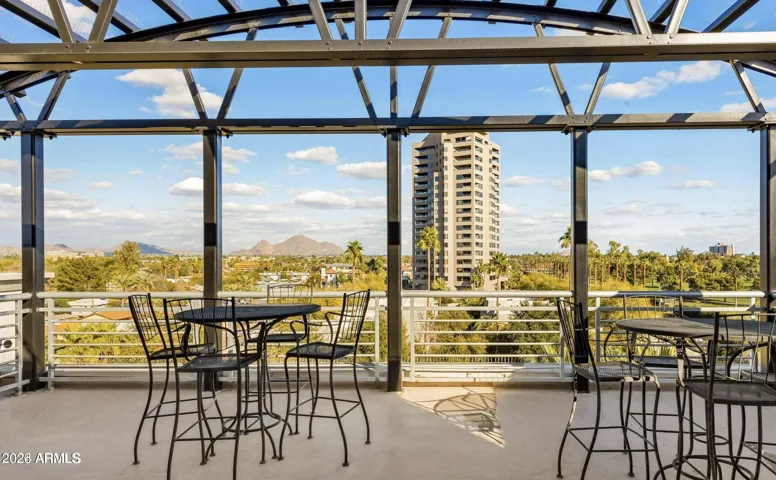 Rooftop area with fireplace and grill