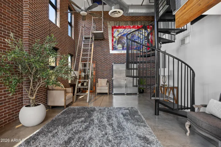 Staircase to roof top deck and staircase to Bedroom 1