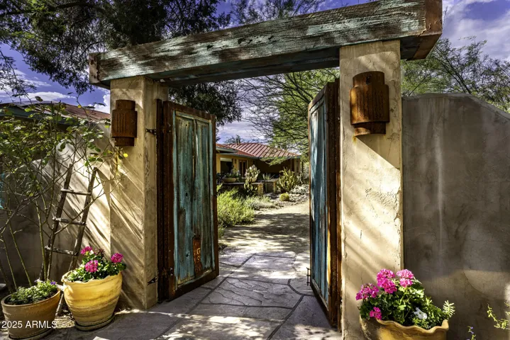 Approximately 30 Acres on the Hassayampa River. Paved Road Access off HWY 60 with 5000+ Sq. Ft Events Center and Workshop, Fish Pond, 3 Private Wells. Exclusive Retreat.
