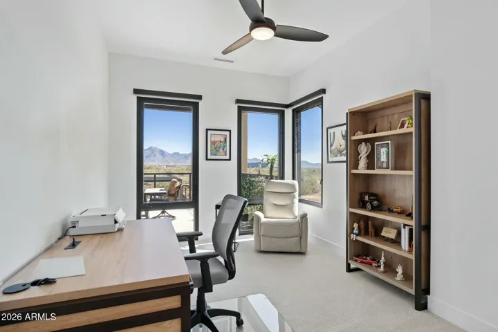 Versatile fourth bedroom ideal for office, fitness, or guest accommodations.