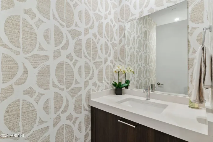 Stylish powder bath conveniently located for guests.
