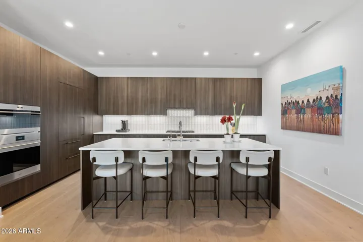 Gourmet kitchen featuring 36" Sub-Zero refrigerator, gas cooktop, wall oven and microwave, Bosch dishwasher.