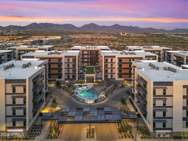 Aerial perspective showcasing the community layout set against the stunning backdrop of the McDowell Mountains and surrounding desert landscape.
