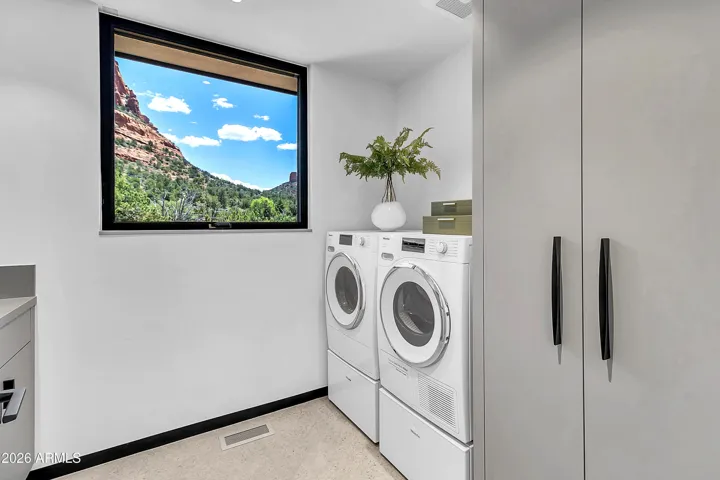 Shouldn't every laundry room have a view? Miele washer & dryer included.