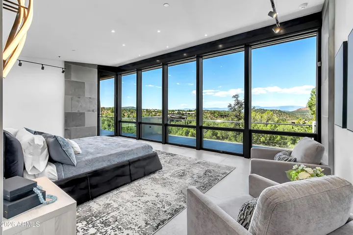 The primary suite is truly a space of wonder & delight filled with natural light, views & access out to your own private patio.