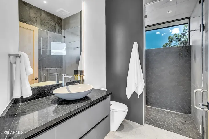 Bathroom #3 no curb steam shower with designer tile & layout. Located between the office & the lounge.