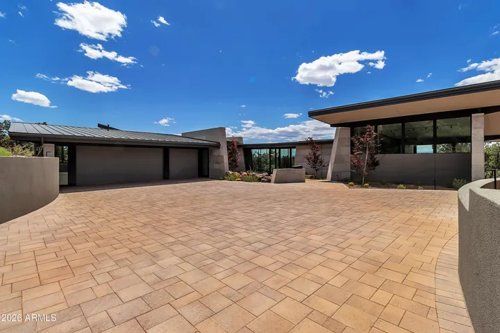 Extended circular concrete pavered driveway. Room for 8 cars.
