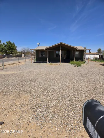 Fenced in property with large corner lot.