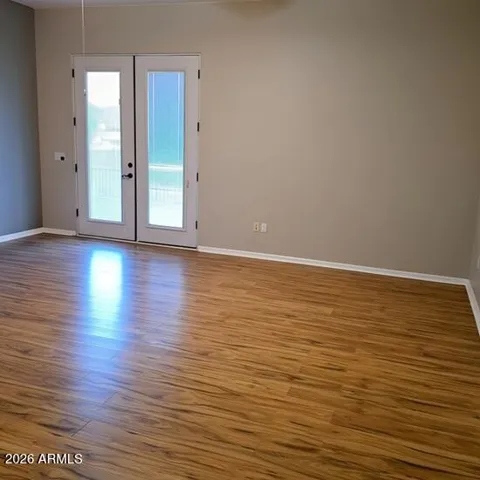 large ensuite with walk in closet & double door patio access
