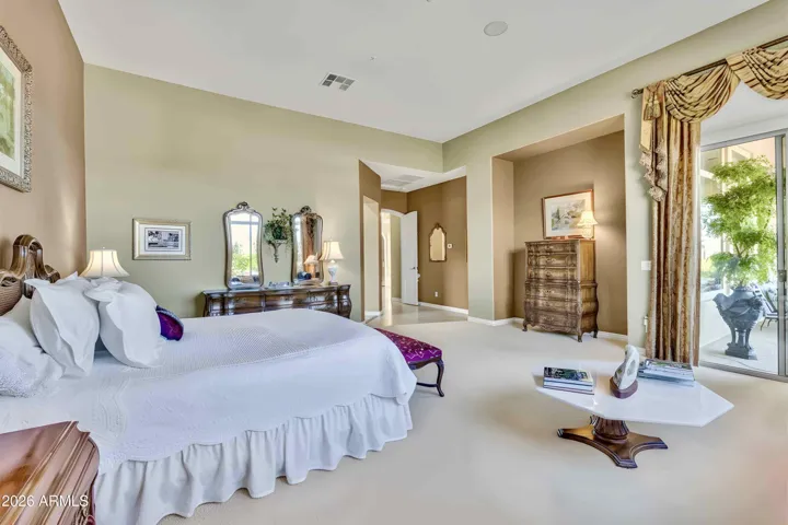 Airy and open this primary bedroom is grand!