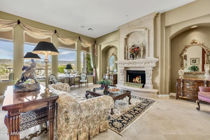Check out this bright living room with stunning fireplace.