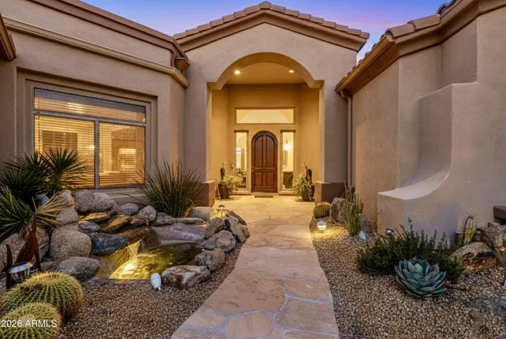 Entry has fountain and sitting area.