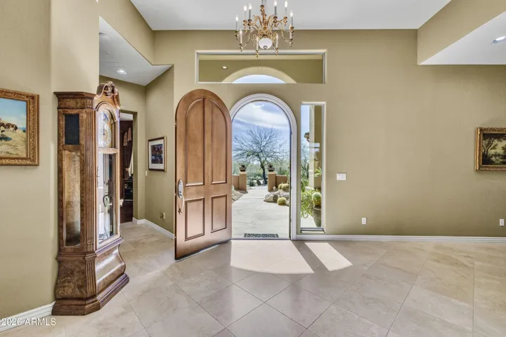 Airy entry opens to front room with pool & mountain views!