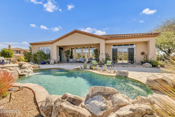 Resort-like backyard with pool, spa, water feature & firepit.