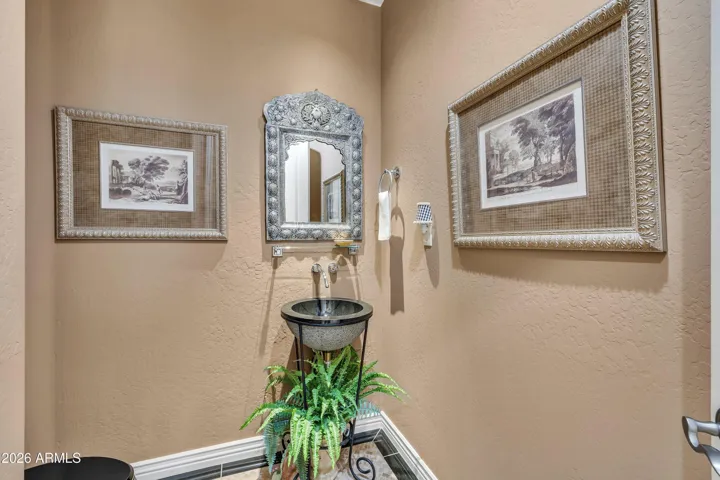 Powder room w decorative vessel sink.