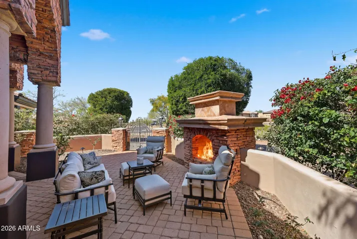 Private courtyard entry with fireplace and seating area