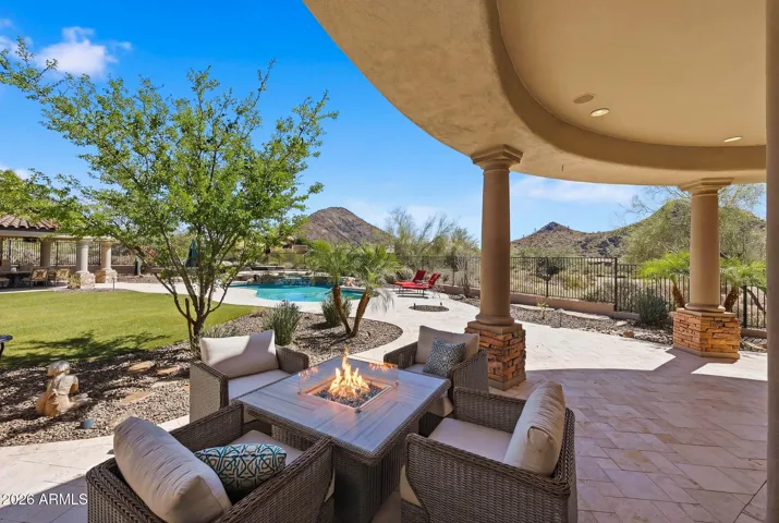 Resort-style backyard with sweeping desert and mountain views