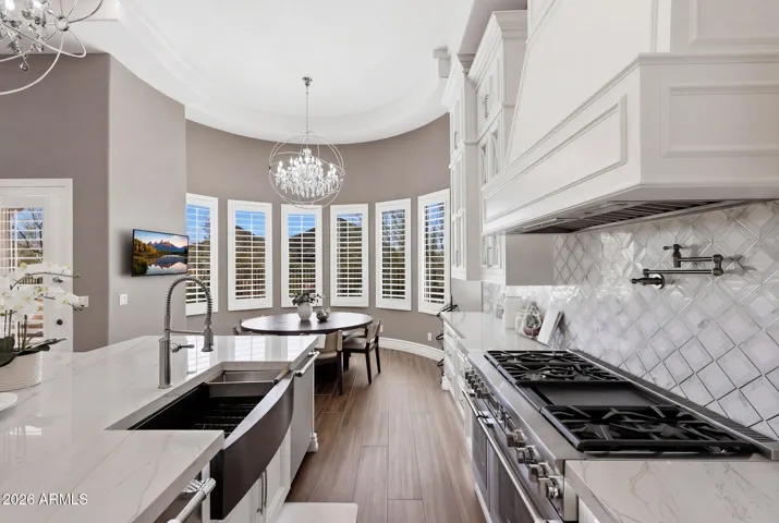 With breakfast seating framed by a wall of windows