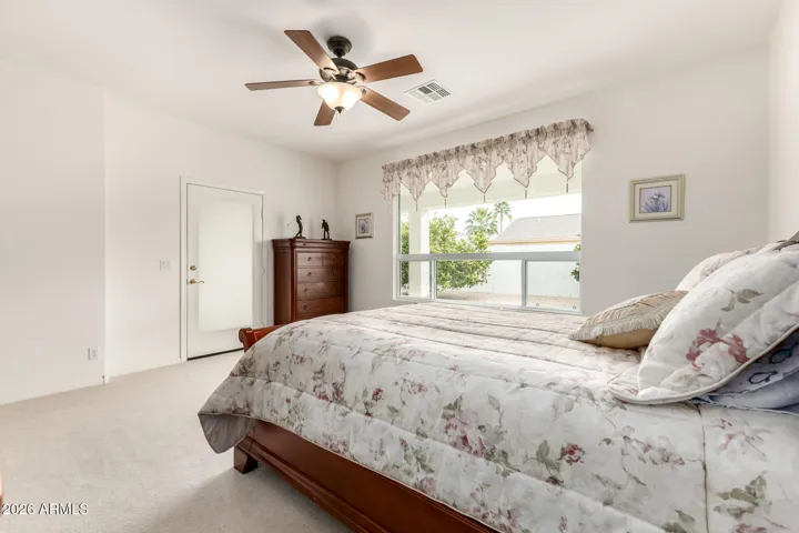 primary suite with private access to the patio