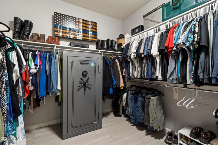 The generous walk-in closet offers extensive hanging space, shelving, and room for organization. Conveniently located off the primary suite, this feature adds functionality and storage value to this Peoria home.