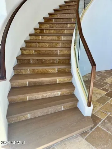 Refreshed stairs with beautiful wood plank flooring