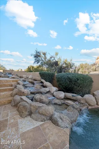 Rock waterfall features from Spa down to pool