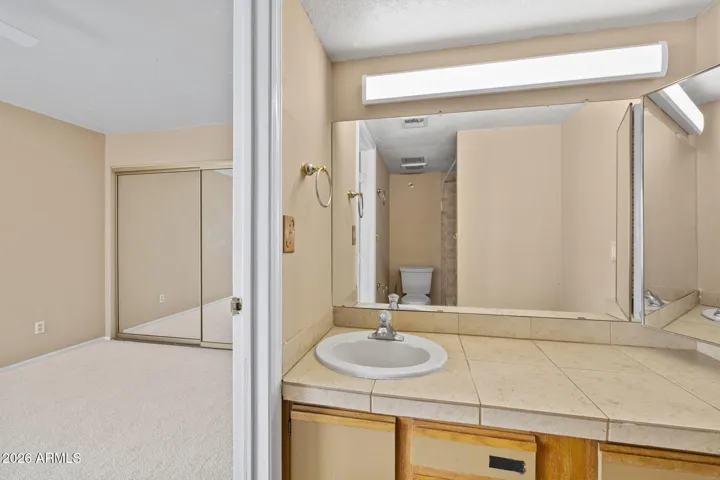 Primary bathroom with extended vanity and ample counter space.