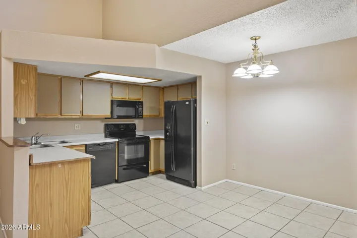 Kitchen with generous work area and adjacent dining space.