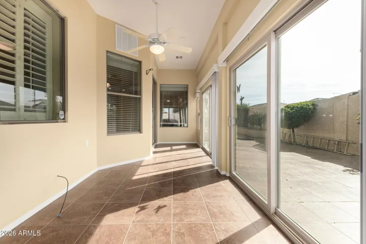 Sunroom built at original build with Farnsworth has (3) sets of arcadia doors to backyard patio