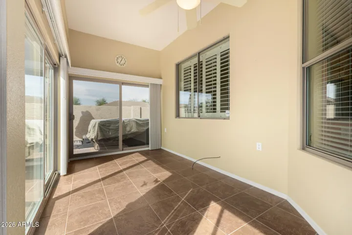 Sunroom built at original build with Farnsworth has (3) sets of arcadia doors to backyard patio