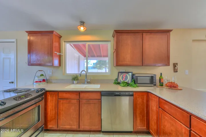 Stainless appliances and a countertop microwave