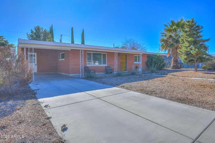 Covered carport and security door entry