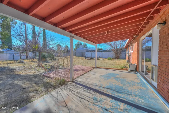 Covered back patio perfect for relaxing or grilling