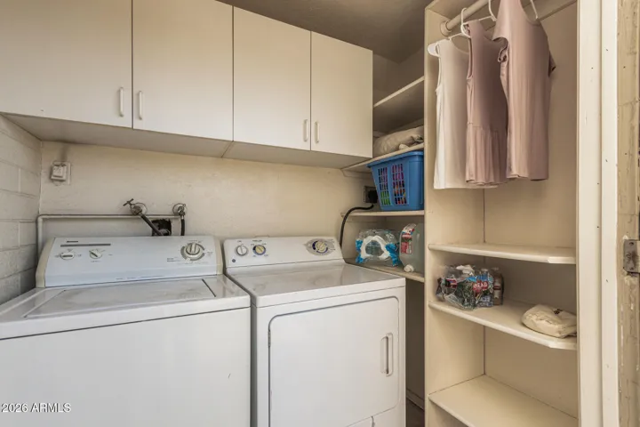 Private laundry room with plenty of storage