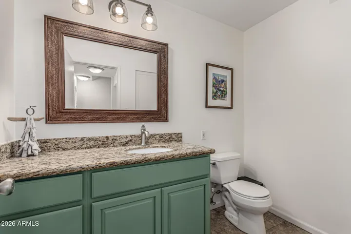 Large half-bath powder room with extra storage
