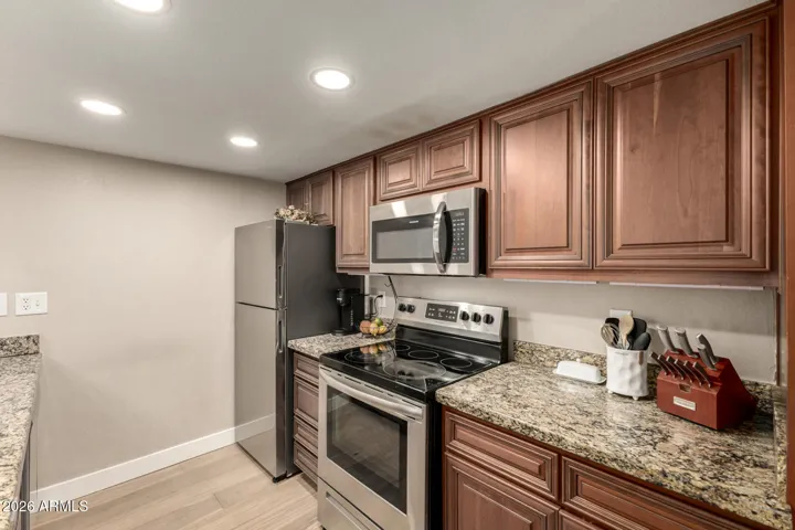 Stainless steel appliances, lots of cabinets and countertop space. The pantry has pull out cabinets as well.