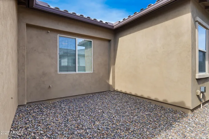 Side yard hidden storage or possibly future patio!