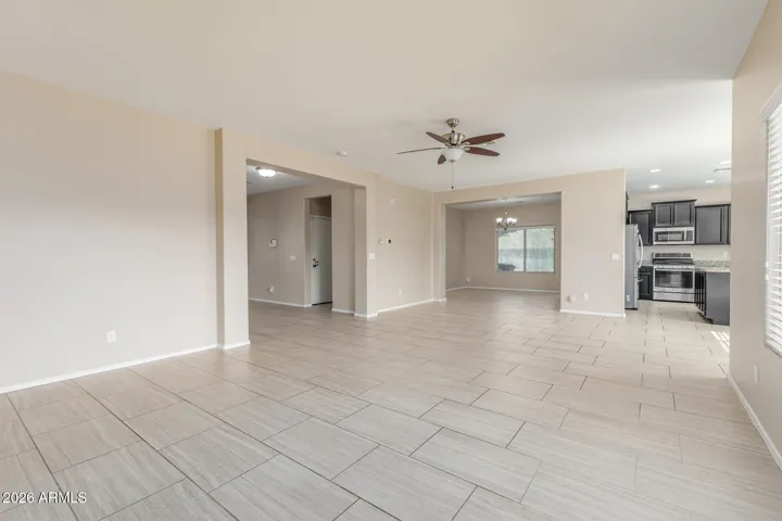 Great Room w/ view to entry hall, dining room & kitchen