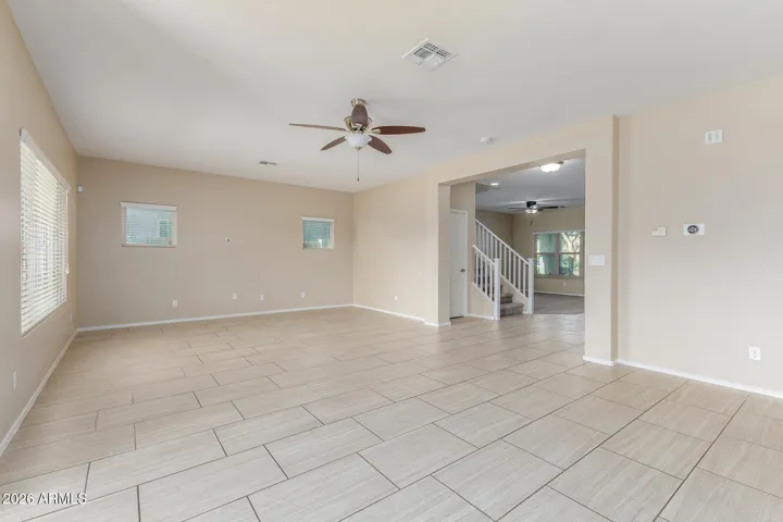 Great room w/ view to den & stairs