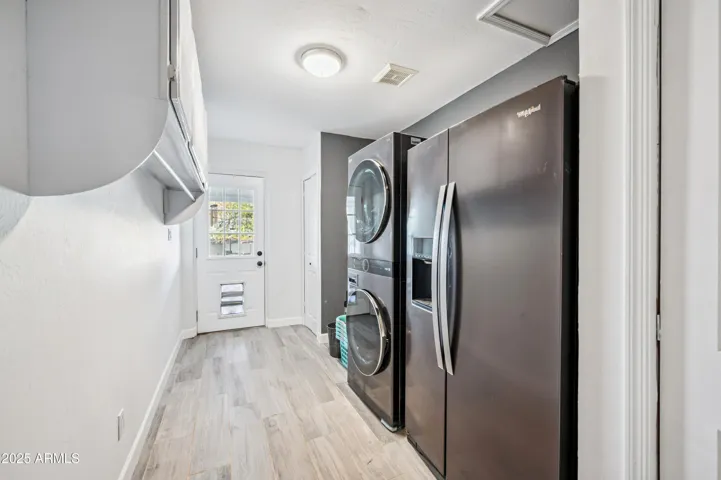 Large laundry room with room for freezer.