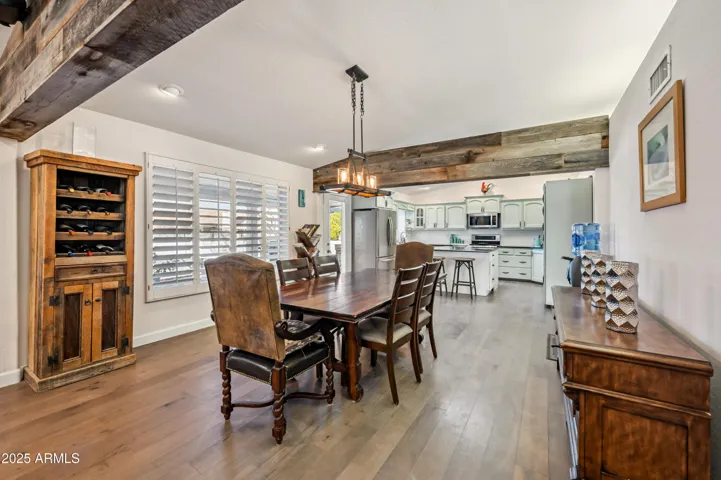 Large dining space with exposed wood beams!