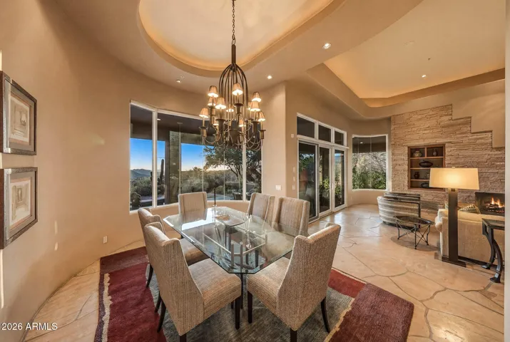 Defined dining space with windows framing desert surroundings