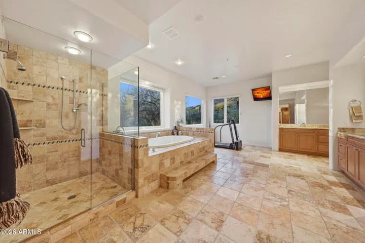 Featuring a walk in shower, Hydro systems jetted tub and dual vanities!