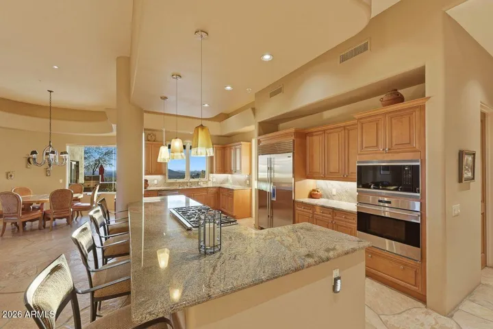 Featuring a center island with counter height seating, and updated built-in appliances